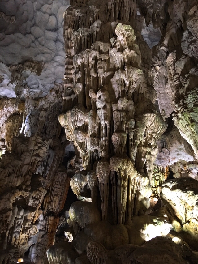 Inside Động Thiên Cung cave with colorful stalactite formations.